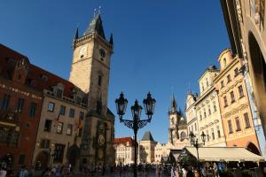 a group of buildings with a clock tower at Hotel Liliova Prague Old Town in Prague