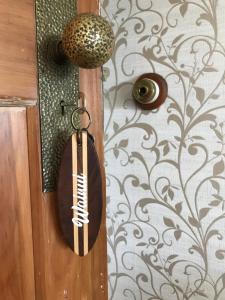 a door with a comb hanging on a wall at Cedar House in Gisborne