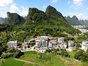 a scenic view of a city with mountains at The Bamboo Leaf Yangshuo in Yangshuo