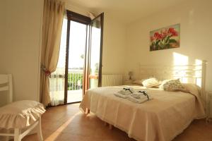 A bed or beds in a room at Birgi holiday home