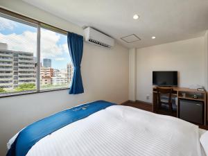 エナジックホテル山市 Enagic HOTEL YAMAICHIにあるベッド