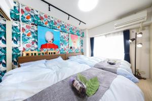 Tempat tidur dalam kamar di Mezon Etowaaru