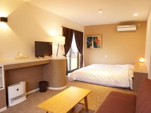 Кровать или кровати в номере Ducale Garden Hotel Kujukuri