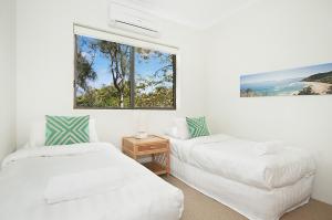 A bed or beds in a room at Byron Bay Accom Koranba on Lawson