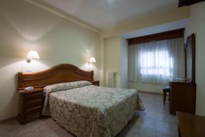 Postel nebo postele na pokoji v ubytování Hotel Riviera