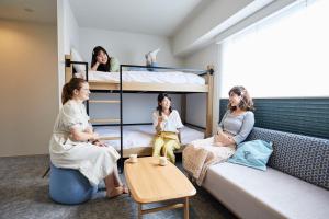 Postel nebo postele na pokoji v ubytování THE TOURIST HOTEL & Cafe AKIHABARA