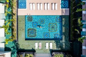 an overhead view of a swimming pool in a building at InterContinental Phuket Resort by IHG in Kamala Beach