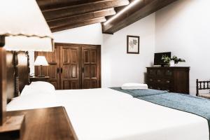 Postel nebo postele na pokoji v ubytování Hotel rural Entreviñas