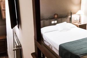 Postel nebo postele na pokoji v ubytování Hotel rural Entreviñas