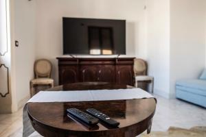 Spa sul tempio d'apolloにあるテレビまたはエンターテインメントセンター