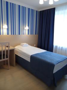 
A bed or beds in a room at Pulkovo Hotel
