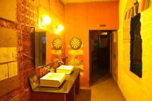 a bathroom with two sinks and a mirror at Hide-In Pushkar in Pushkar