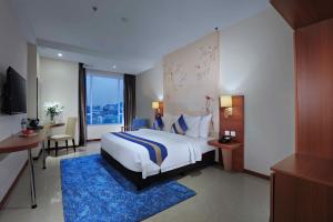 Letto o letti in una camera di Aston Inn Gideon Batam