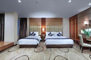 Letto o letti in una camera di Aston Inn Gideon Batam