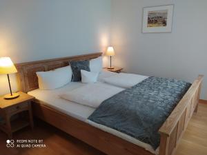 Ein Bett oder Betten in einem Zimmer der Unterkunft Weinhotel Atrium