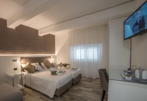 Posteľ alebo postele v izbe v ubytovaní Angel's Care B&B