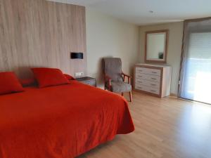 A bed or beds in a room at El Retiro