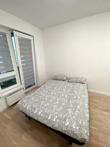Katil atau katil-katil dalam bilik di Wolfie Apartment