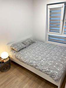 Katil atau katil-katil dalam bilik di Wolfie Apartment