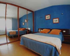 A bed or beds in a room at El Retiro
