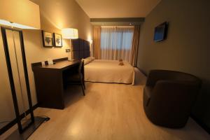 Postel nebo postele na pokoji v ubytování Hotel Torre de Núñez
