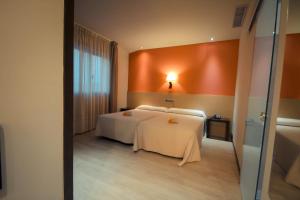 Postel nebo postele na pokoji v ubytování Hotel Torre de Núñez