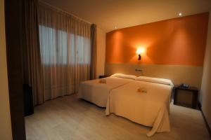 Postel nebo postele na pokoji v ubytování Hotel Torre de Núñez