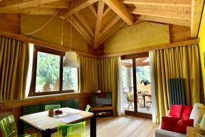 a living room with a couch and a table at MH Olen Boutique Hotel in Alagna Valsesia