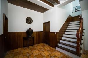 a hallway with stairs in a house at Ryan's Guesthouse in Xiyu