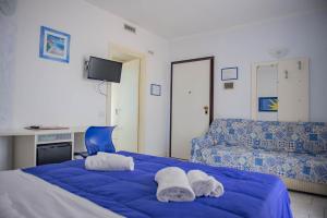 Postel nebo postele na pokoji v ubytování Hotel del Sole