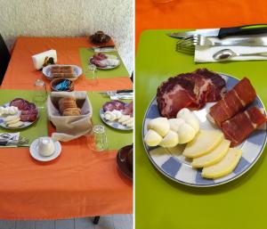a green table with a plate of food on it at B&B Falcone in Ortona