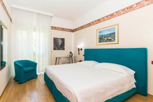 Postel nebo postele na pokoji v ubytování Hotel Royal Torino Centro Congressi