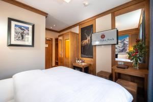 Posteľ alebo postele v izbe v ubytovaní Hotel Eden Rock