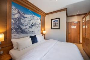 Posteľ alebo postele v izbe v ubytovaní Hotel Eden Rock