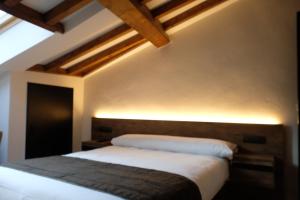Ein Bett oder Betten in einem Zimmer der Unterkunft Via Aetcal Hotel & Wellness