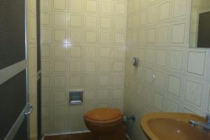 a bathroom with a toilet and a sink at Hotel Barão De Tefé in Rio de Janeiro +33 photos
