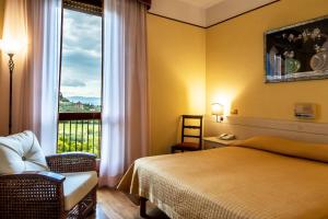 Postel nebo postele na pokoji v ubytování Fortuna Resort + 37 fotografií