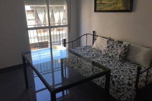 A bed or beds in a room at CASA REFORMADA CON TERRAZA/WIFI/AIRE ACONDICIONADO