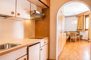 A kitchen or kitchenette at Appartement Strobl Még 11 kép
