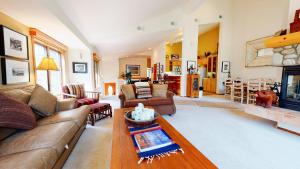 a living room with a couch and a table at Snowcreek #760 condo in Mammoth Lakes