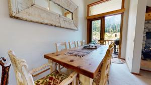 a dining room with a wooden table and chairs at Snowcreek #760 condo in Mammoth Lakes