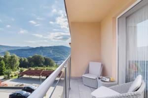 a balcony with a view of the mountains at DreamView Premium Apartment Wisła Kamienna by Renters in Wisła
