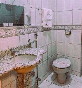 Kylpyhuone majoituspaikassa Hotel Cataguases