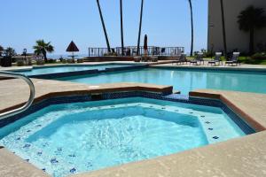 a large swimming pool with blue water at Rosarito Inn in Rosarito