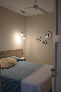 a bedroom with a bed and two plates on the wall at "Josefa" terraza y parrilla - Alojate Mendoza in Mendoza