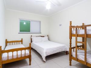 Foto da galeria de Apartamento com ar condicionado e Wi-fi, frente mar - 02 dormitórios - Edifício Luz do Sol em Ubatuba
