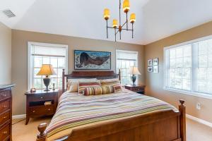 A bed or beds in a room at Lavender Bay Breezes - Private Bay Beach Community
