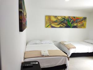 Postel nebo postele na pokoji v ubytování Hotel Tayromar