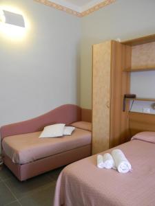 Postel nebo postele na pokoji v ubytování Hotel Parma Mare