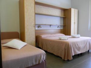 Postel nebo postele na pokoji v ubytování Hotel Parma Mare